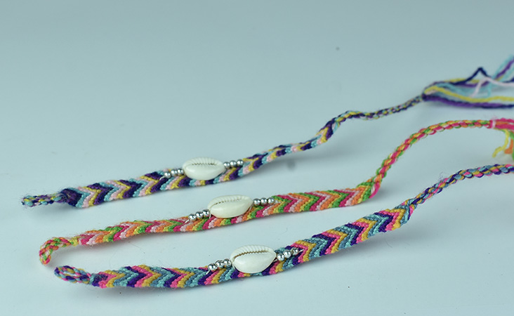 handmade macrame bracelet hand braided cord with sea shell and bead ornament 
