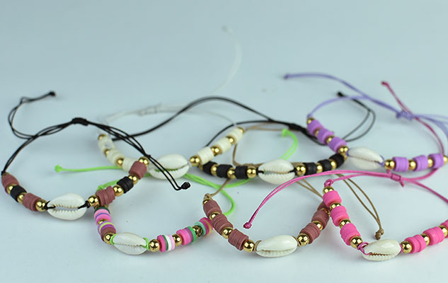 wholeasle bali beach bracelet shell and bead charms with hand braided cord from Bali Indonesia